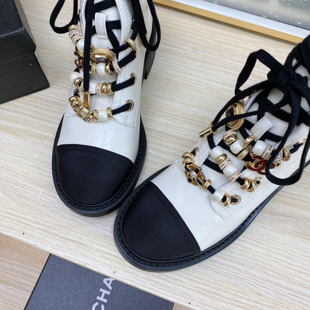 CHANEL COMBAT BOOTS IN WHITE WRINKLED CALFSKIN AND BLACK GROSGRAIN WITH FAUX PEARL